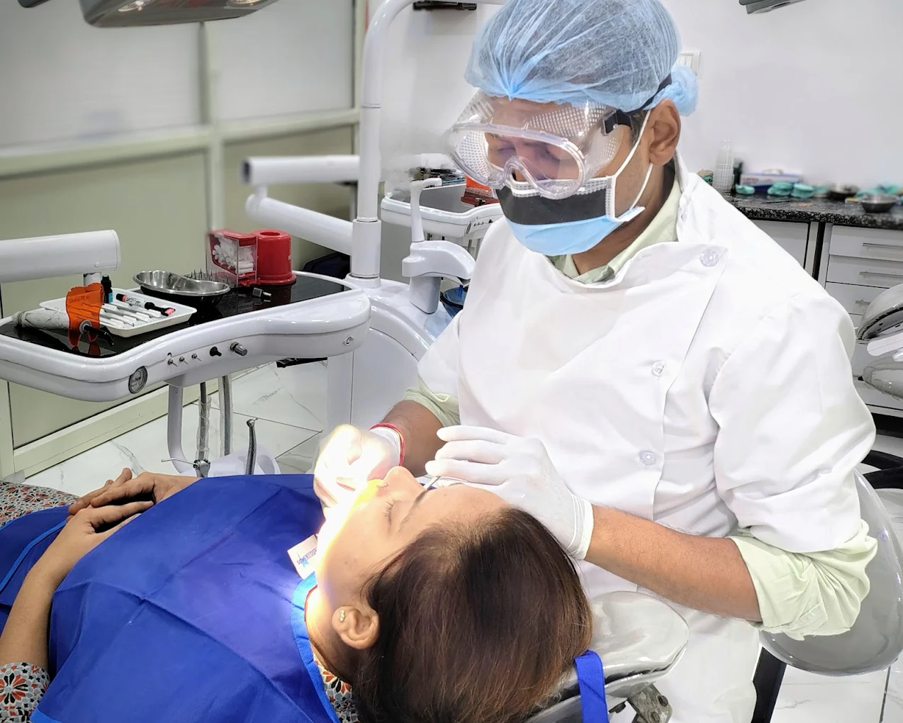 Dr. Abhishek Garg performing dental treatment at Garg Dental Clinic